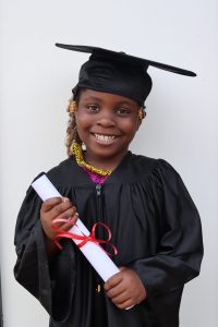 smiling girl holding diploma